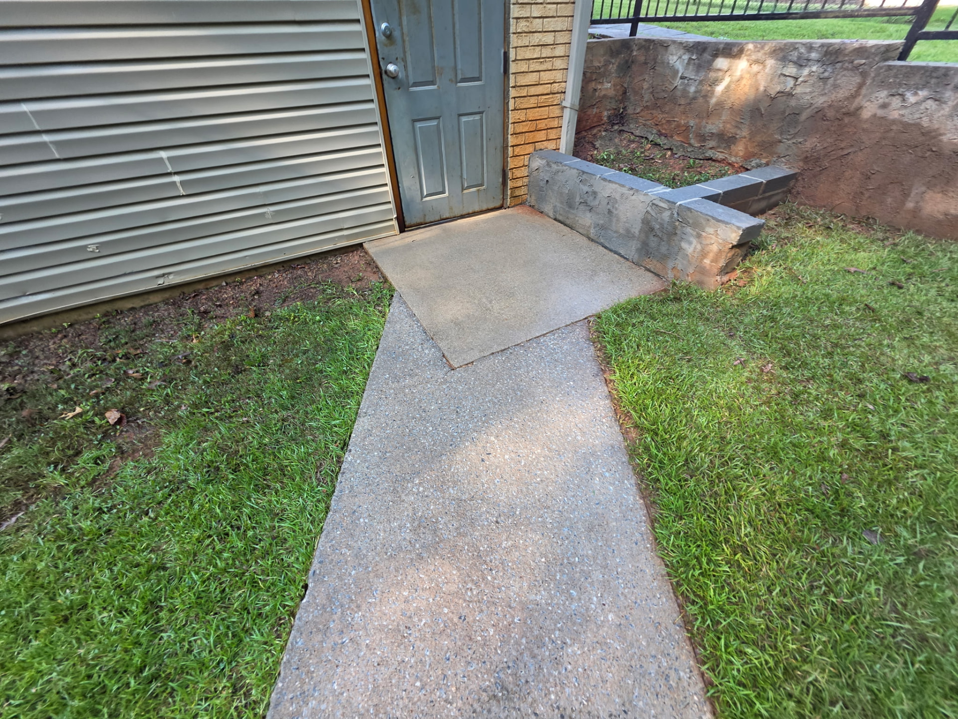 Side Entry Walk & Retaining Wall before and after pressure washing